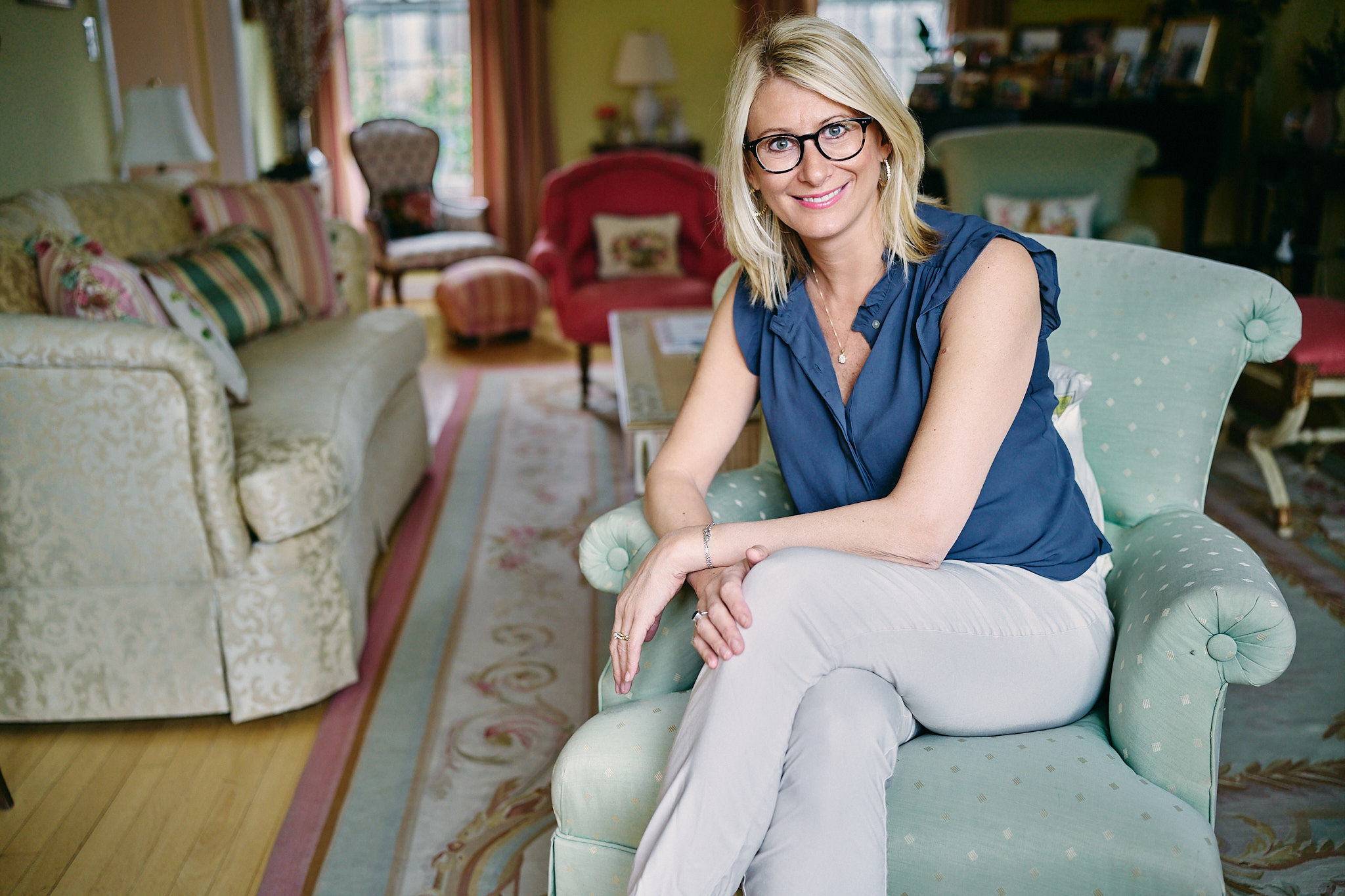 Ali Daggett smiling, seated in her office